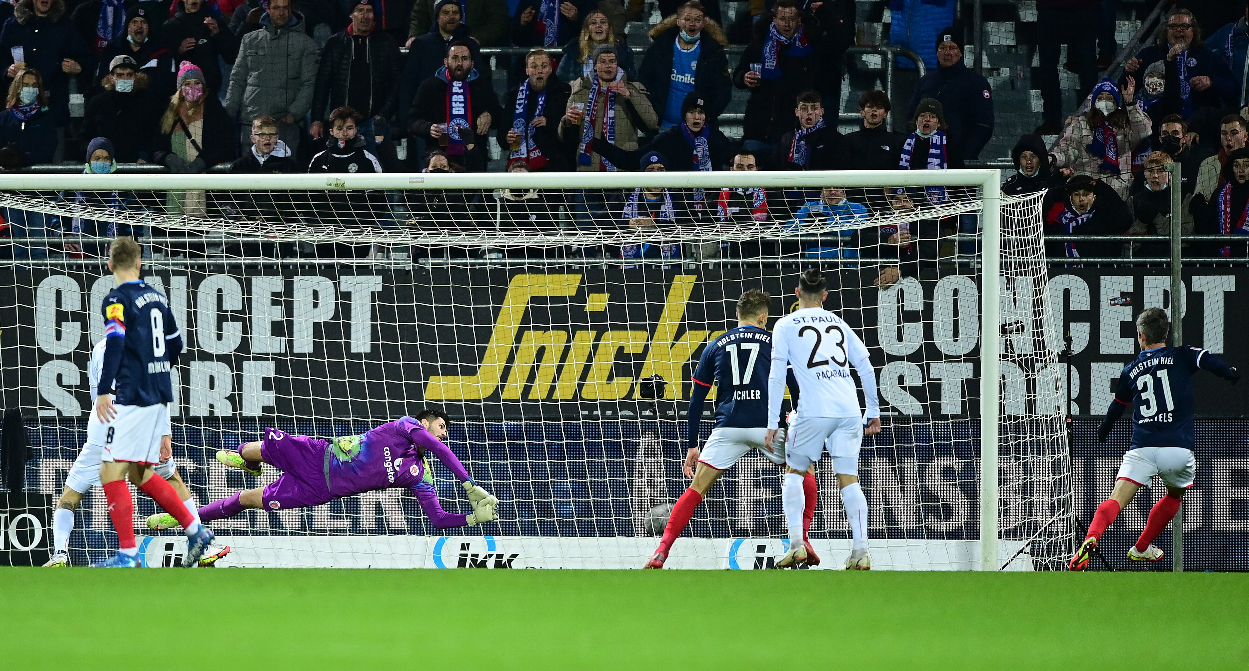 Nikola Vasilj is unable to prevent Fin Bartels from opening the scoring for the home side.