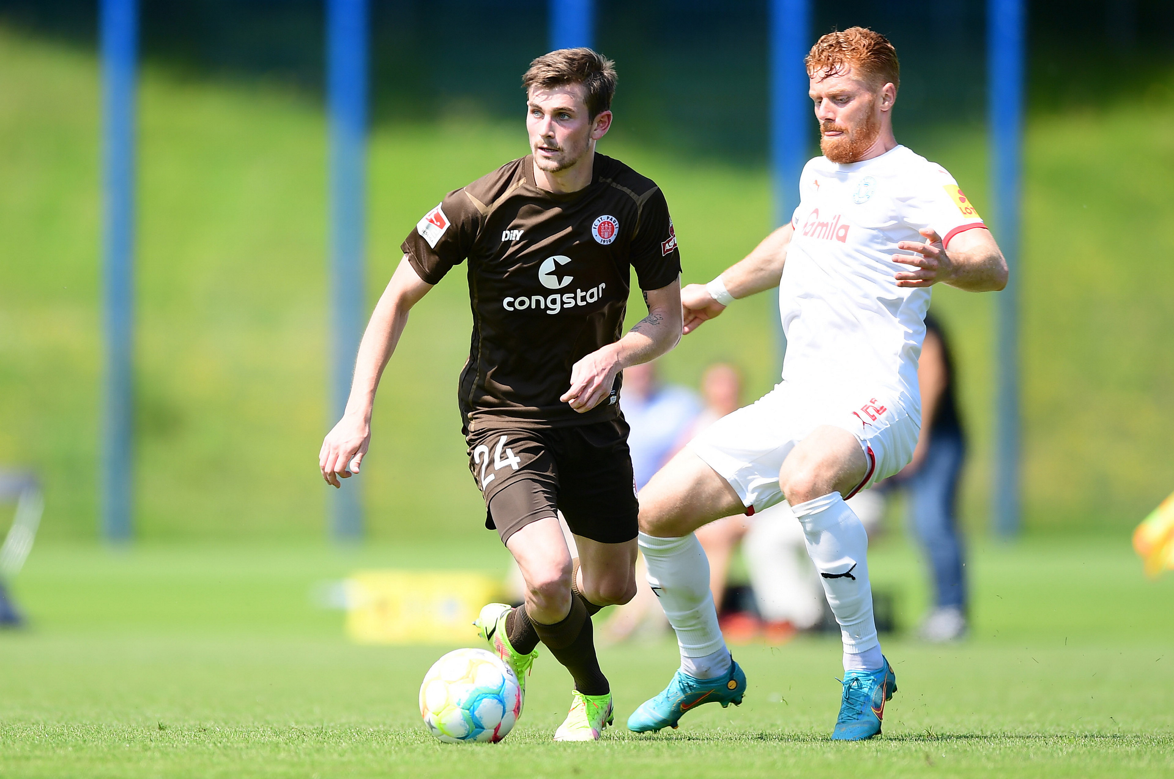 Connor Metcalfe (seen here under challenge from Kiel’s Mikkel Kirkeskov in the recent warm-up game) picked Jackson Irvine’s brain, of course, before his move to the club.