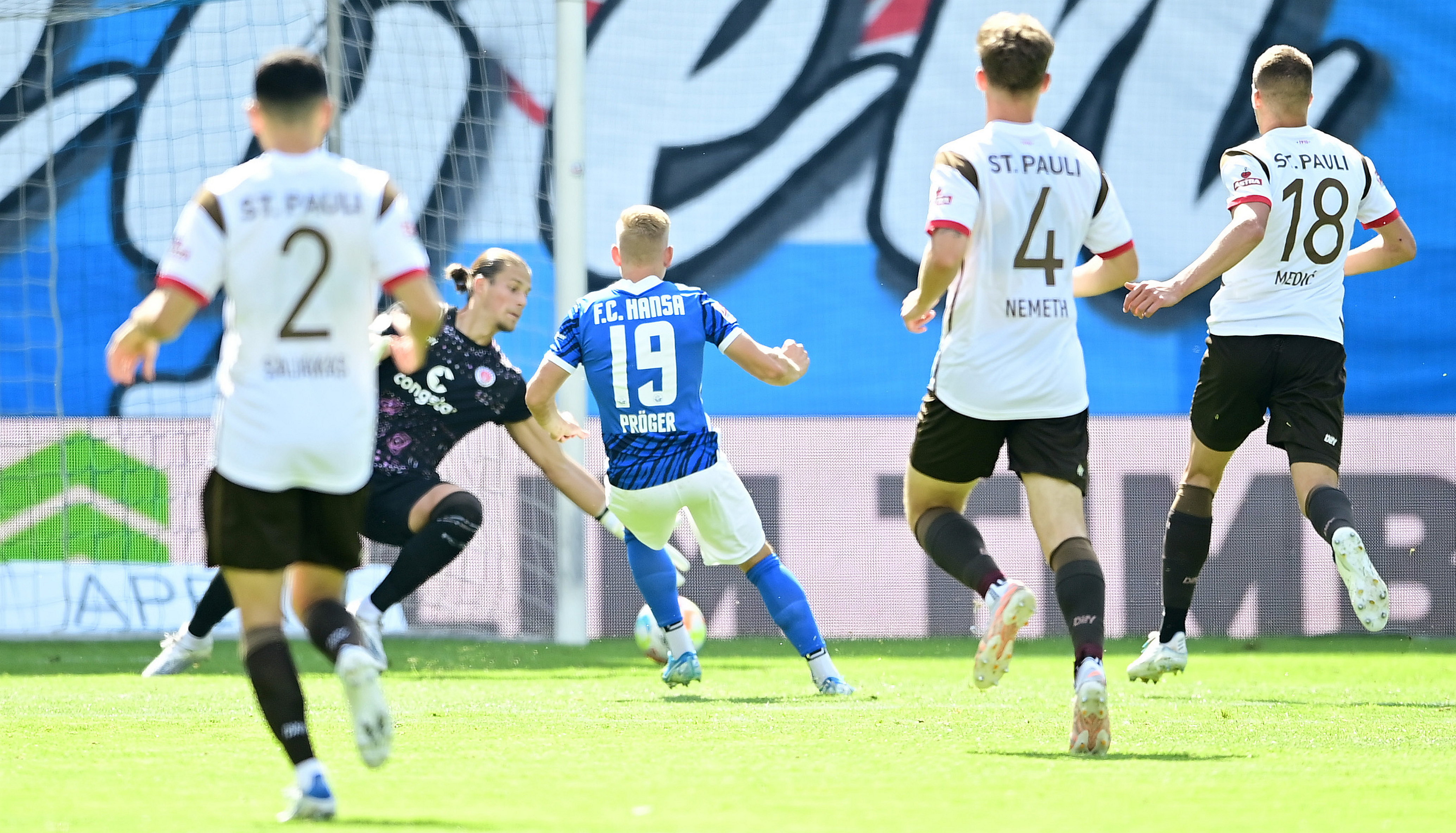 Rostock's Kai Pröger beats Dennis Smarsch in the fourth minute.