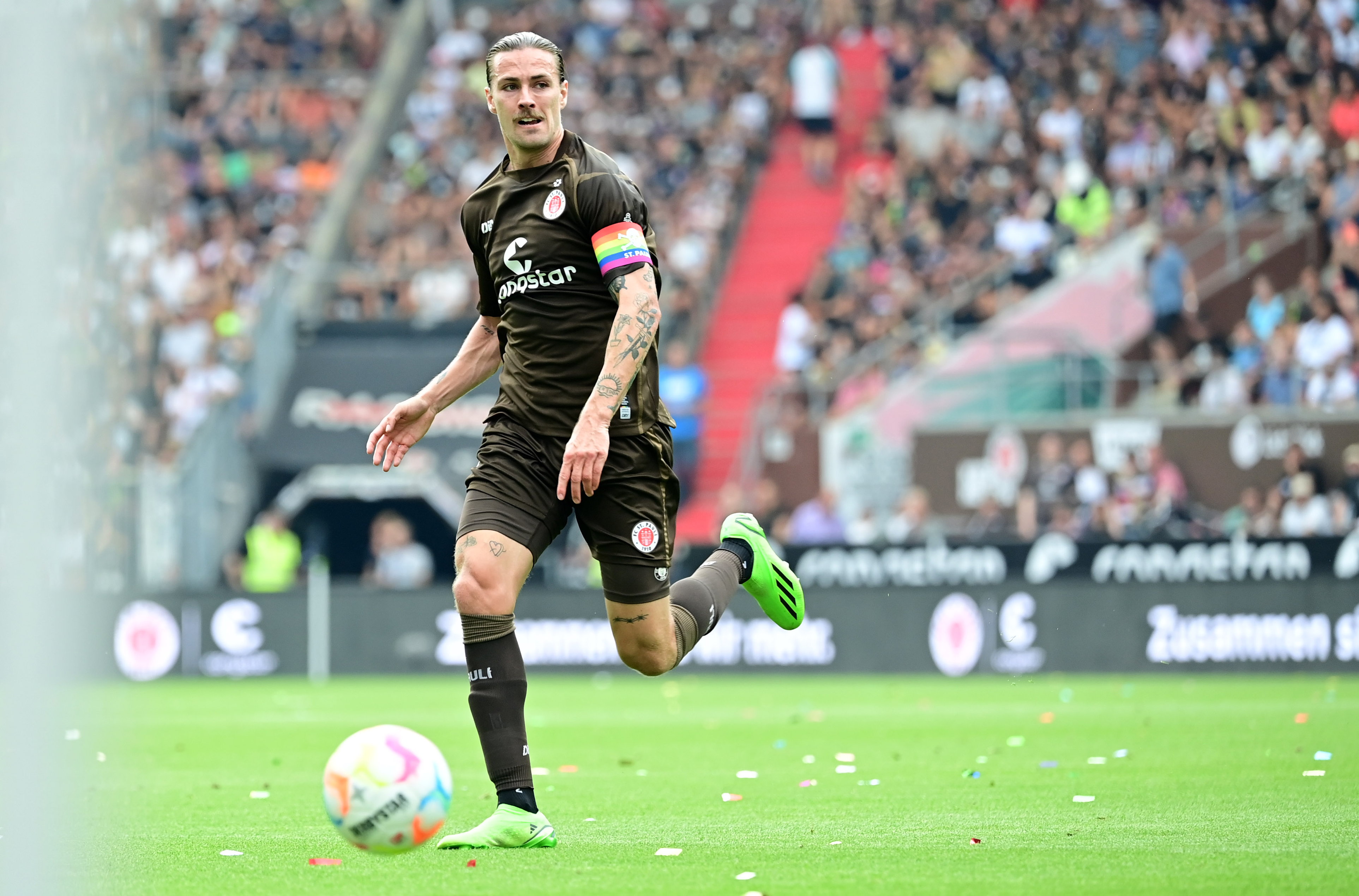 Captain Jackson Irvine with the rainbow armband.