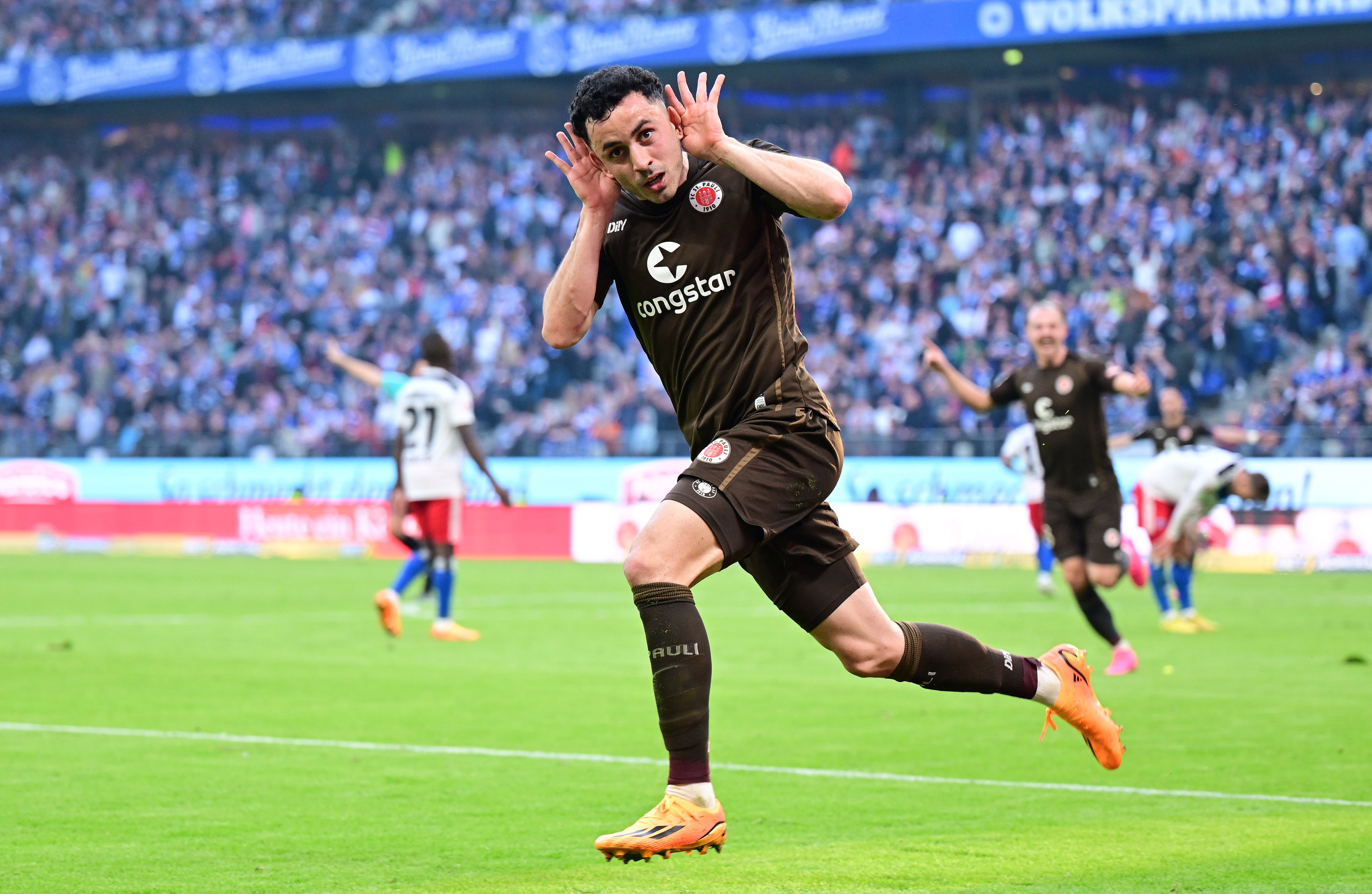 Manolis Saliakas celebrates after opening the scoring.