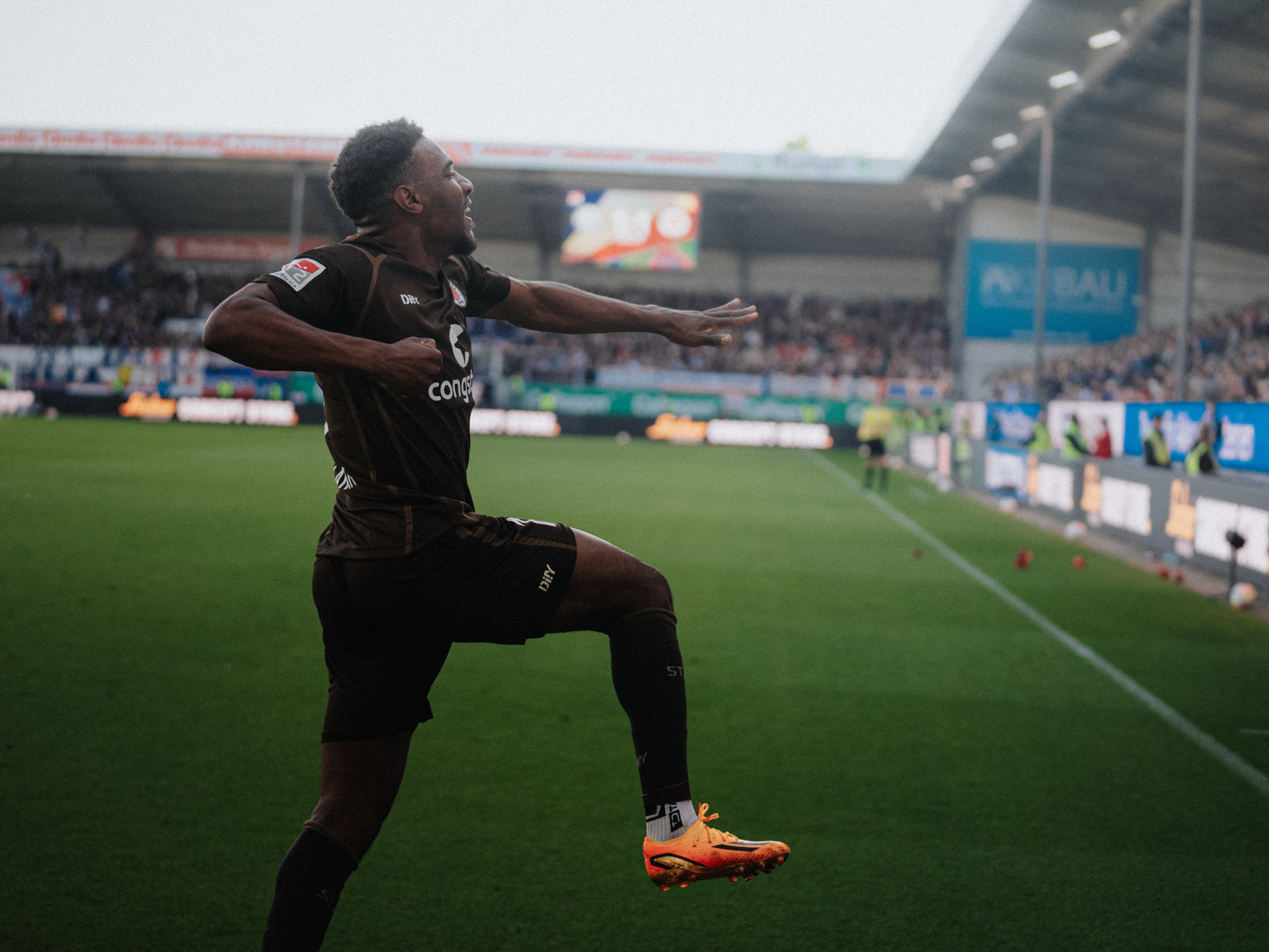 A jubilant Dapo Afolayan celebrates after his 39th minute equaliser.