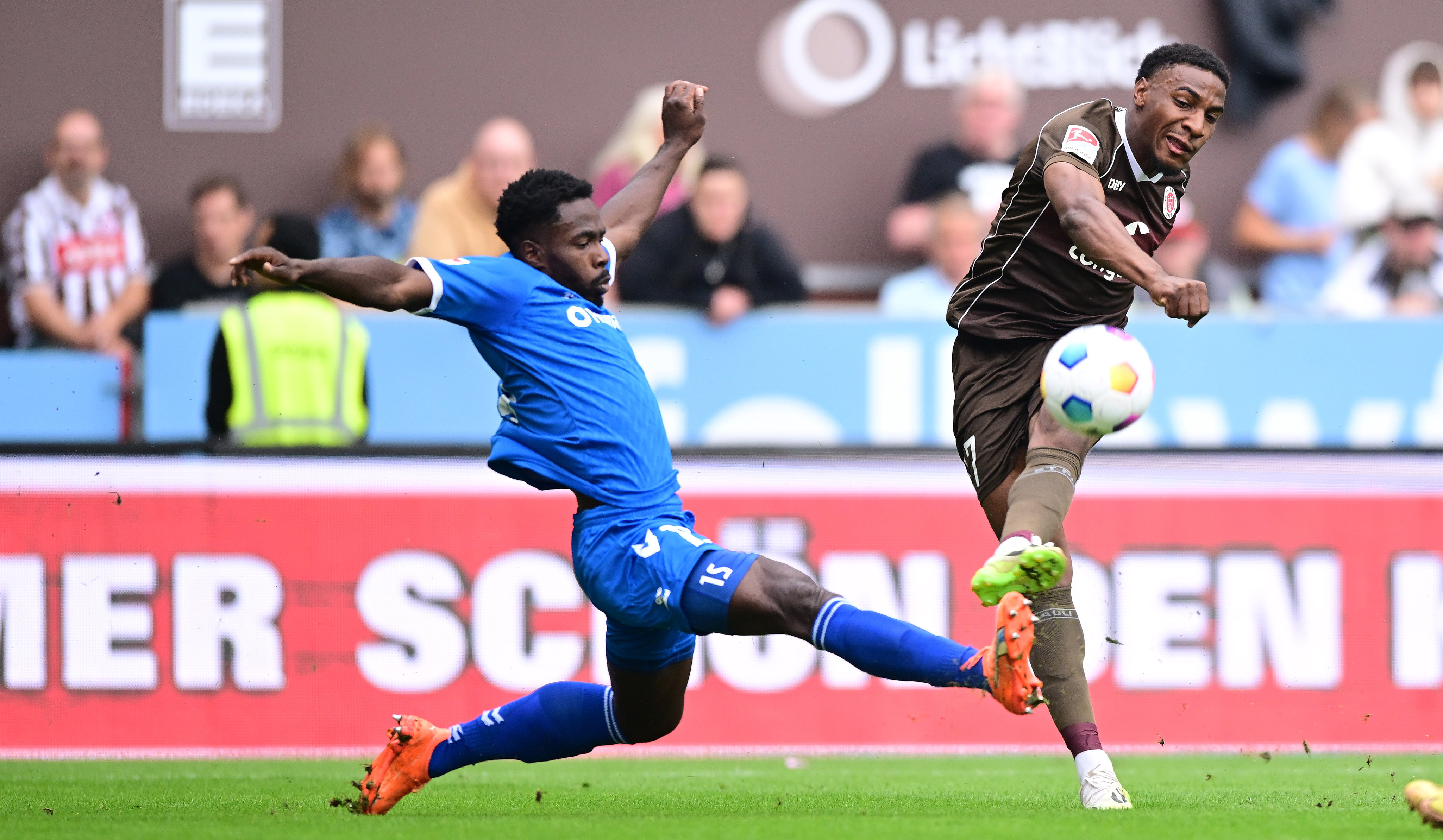 Daniel Heber (left) makes a last-second block to deny Oladapo Afolayan on the quarter-hour.