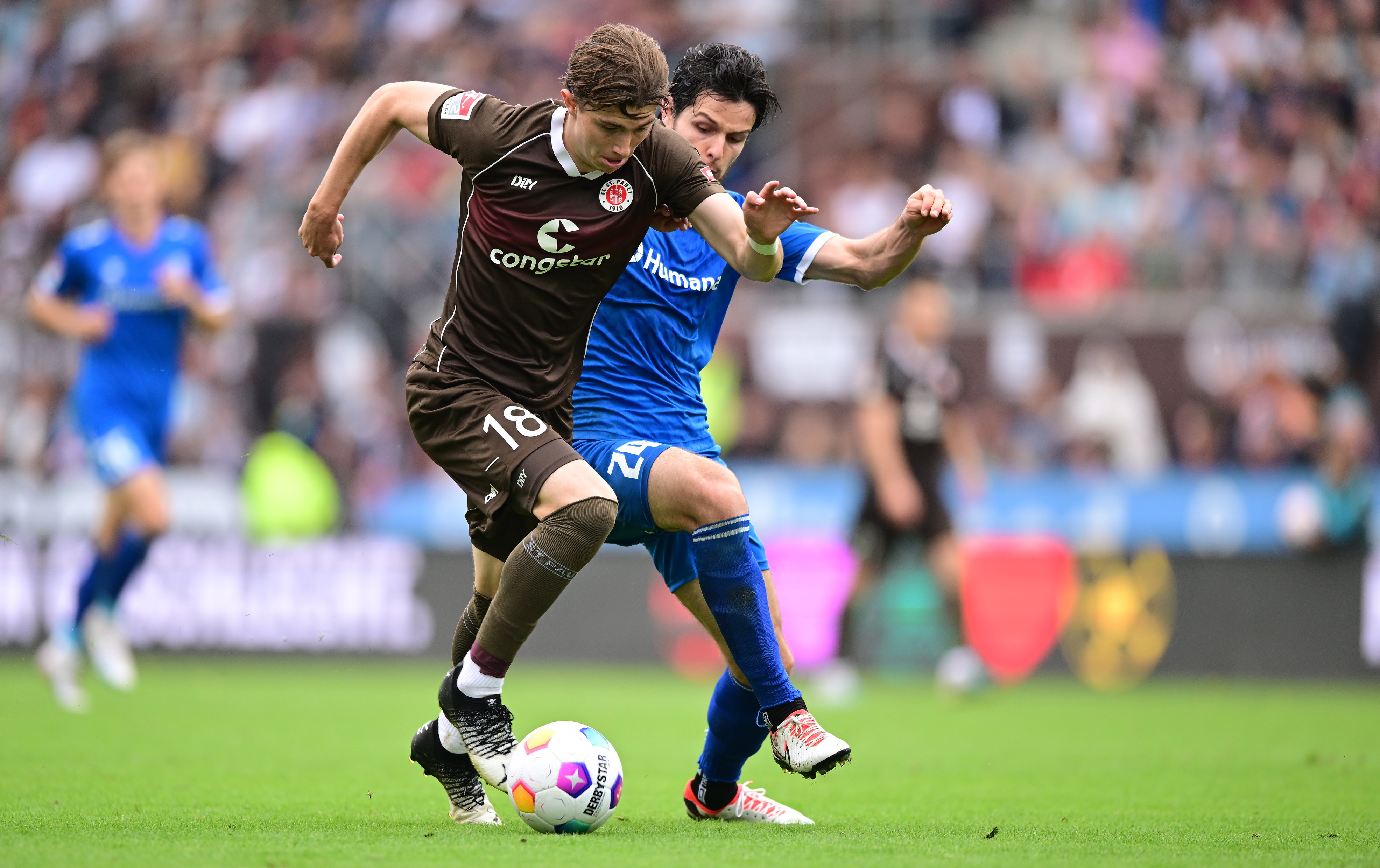 Scott Banks under challenge from Magdeburg’s Jean Hugonet.