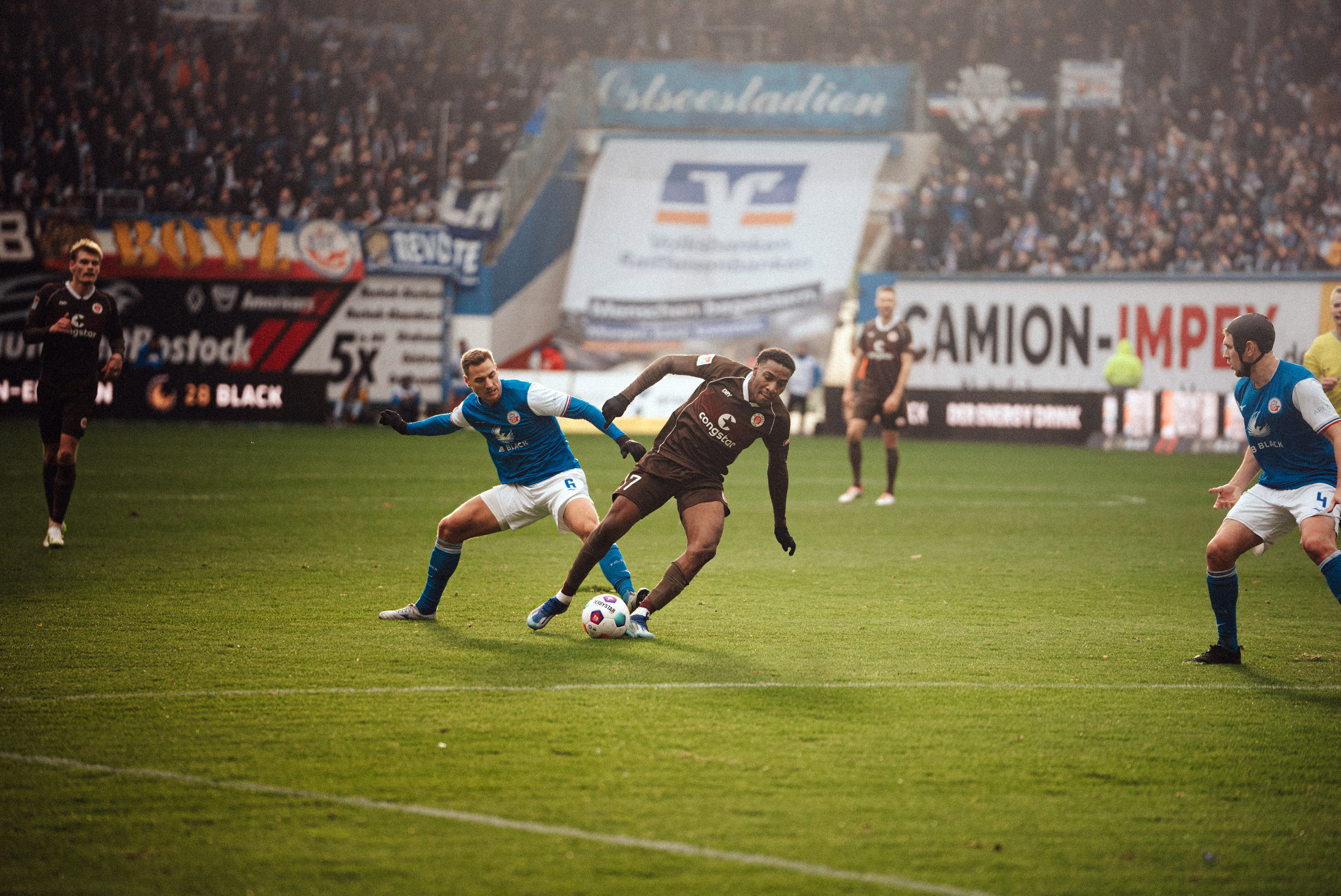 Oladapo Afolayan (here under challenge from Rostock's Dennis Dressel) scored the third goal in the 3-2 win in the reverse fixture.