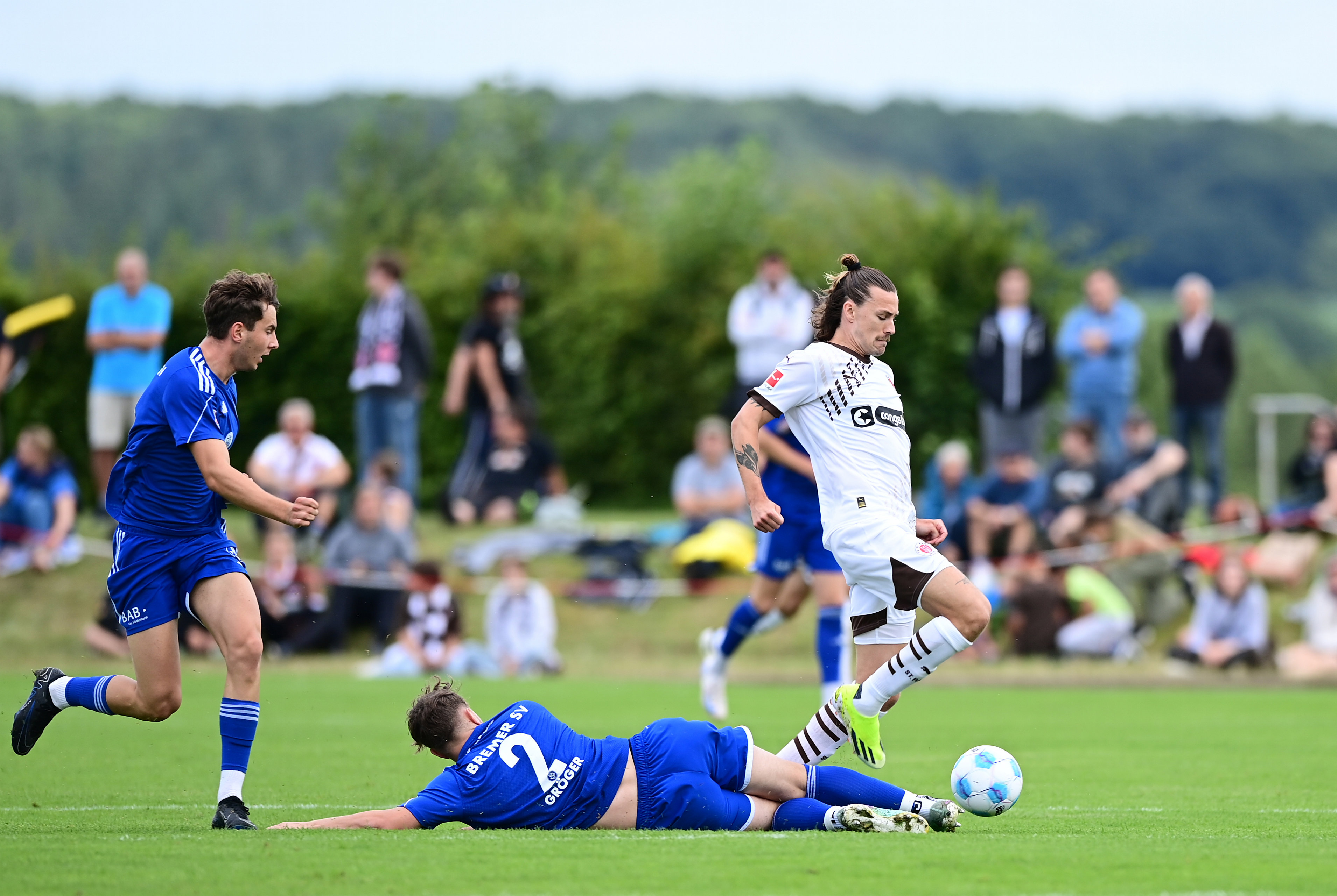 Jackson Irvine (here under challenge from Justin Gröger) was forced off after just eight minutes.