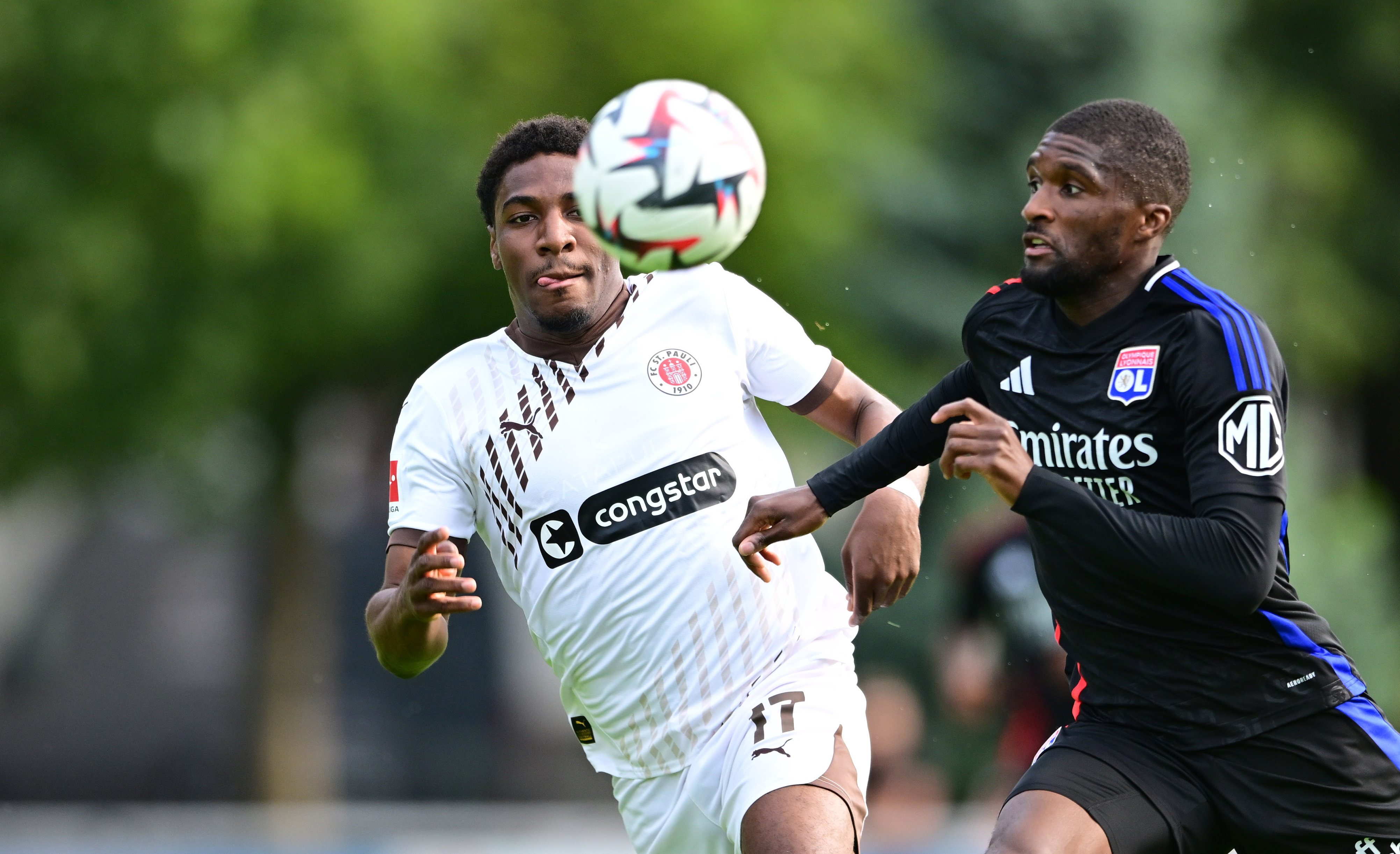 Oladapo Afolayan (here under challenge from Clinton Mata) was very busy in the first half and had the best chance for the Boys in Brown.