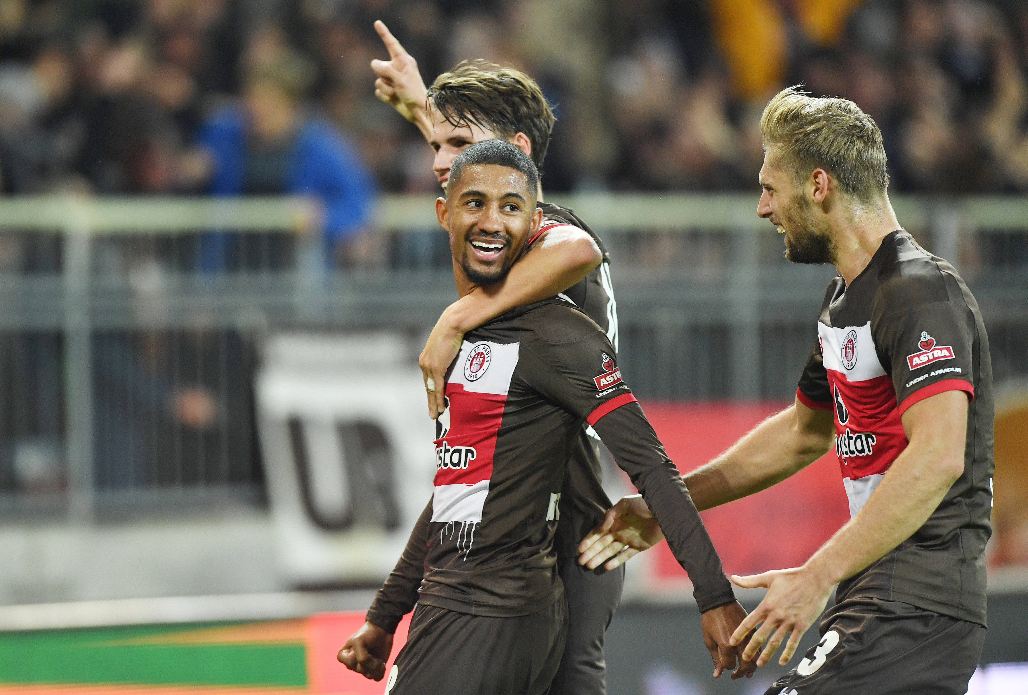 Luca Zander (back), Lasse Sobiech (right) and goalscorer Jeremy Dudziak celebrate the opener.